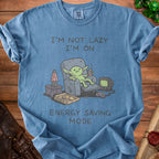 Blue t-shirt with graphic of creature in recliner saying "I'm Not Lazy I'm On Energy Saving Mode".