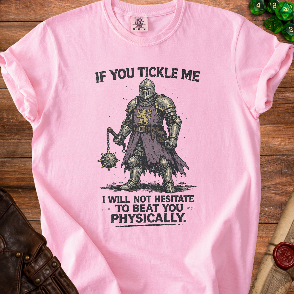 Pink t-shirt with drawing of knight and text "If you tickle me I will not hesitate to beat you physically."