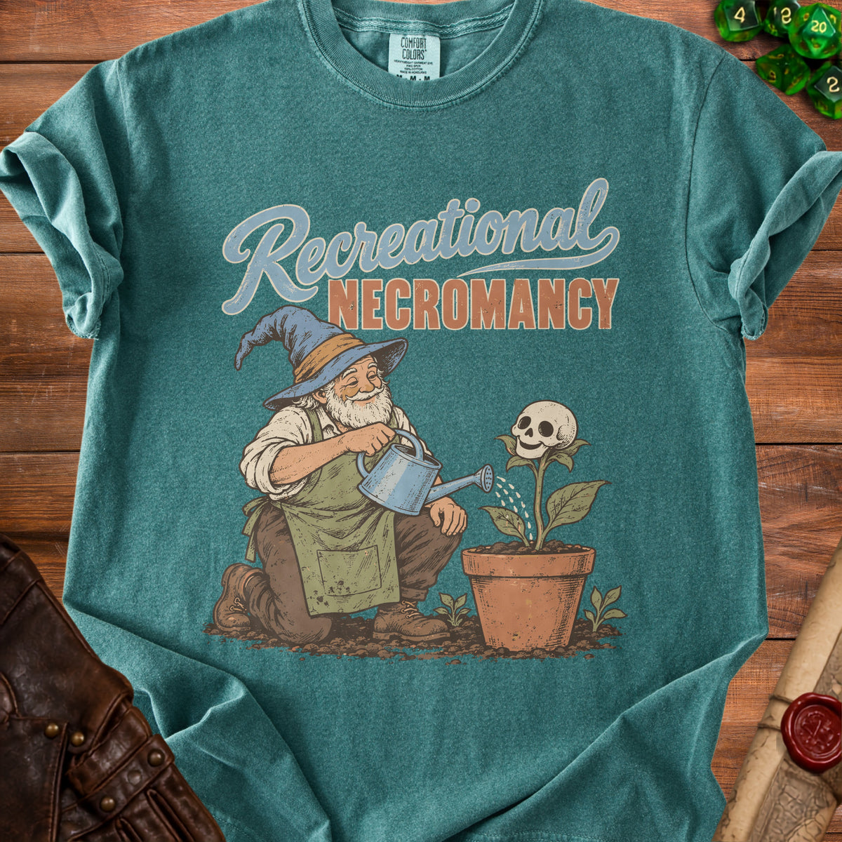 T-shirt graphic of wizard watering skull flower with text "Recreational Necromancy".