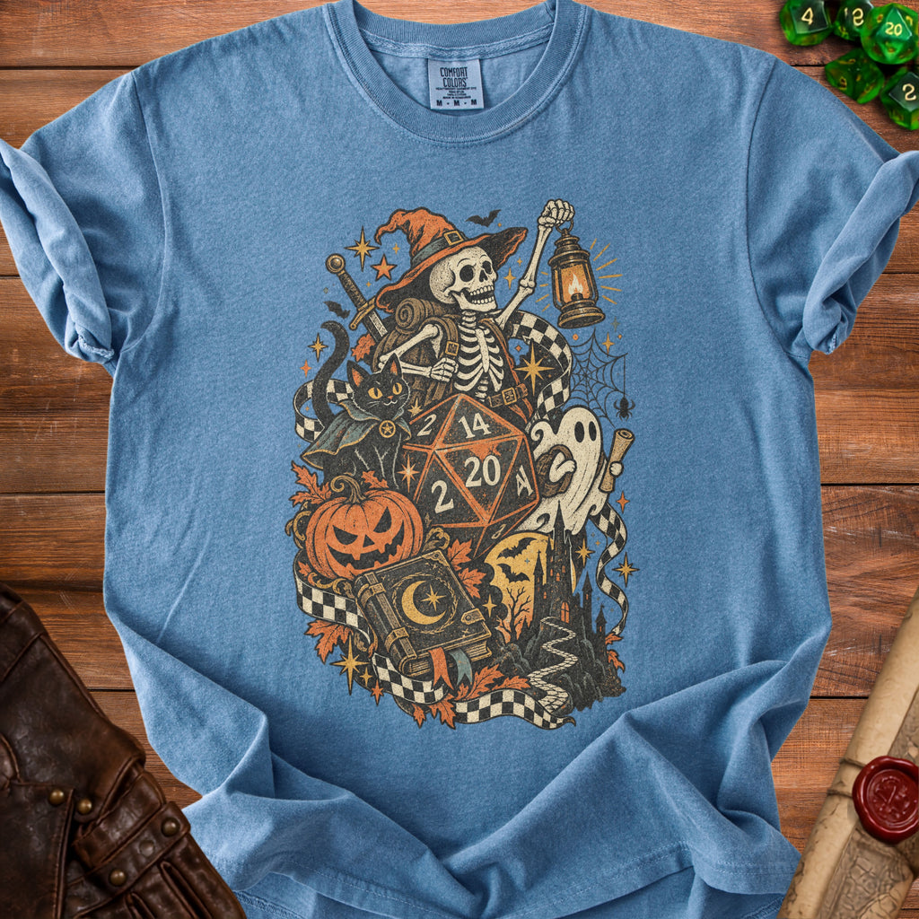 Skeleton in witch hat with lantern, black cat, dice, and Halloween imagery on t-shirt.