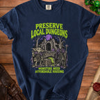Dark blue t-shirt with "Preserve Local Dungeons" and "Monsters Need Affordable Housing" text and artwork.