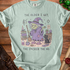 Light blue t-shirt with a witch and black cat graphic and text "The older I get, the f*cker the no."