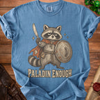 Raccoon paladin with shield and sword on blue t-shirt, text "PALADIN ENOUGH".