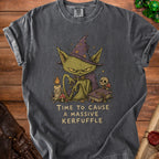 Dark gray t-shirt with a cartoon witch cat, candle, mushrooms, skull, and book. Text reads "Time to Cause a Massive Kerfuffle".