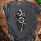 Dark grey t-shirt with a black and white illustration of a knight sitting.