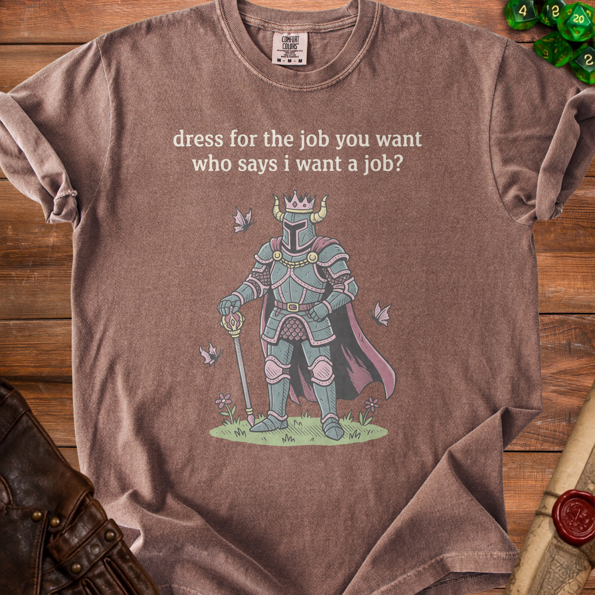 Brown t-shirt with knight graphic and text "dress for the job you want who says i want a job?".