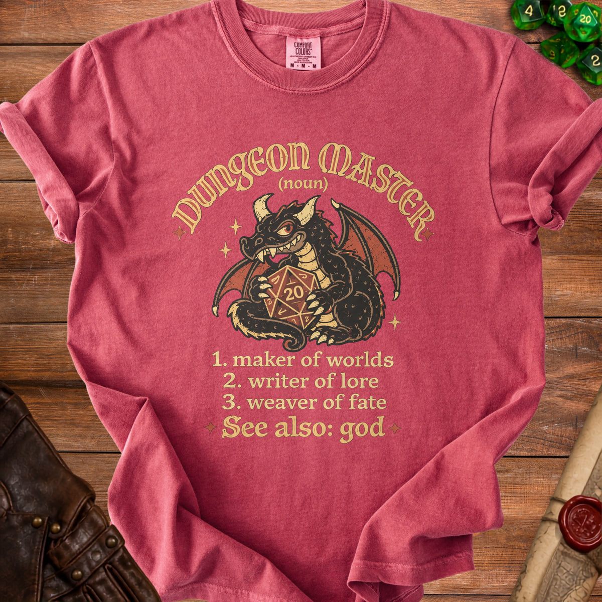 Crimson t-shirt with black dragon holding a 20-sided die and text about "Dungeon Master".