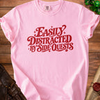 Pink t-shirt with red text that says "Easily Distracted by Side Quests".