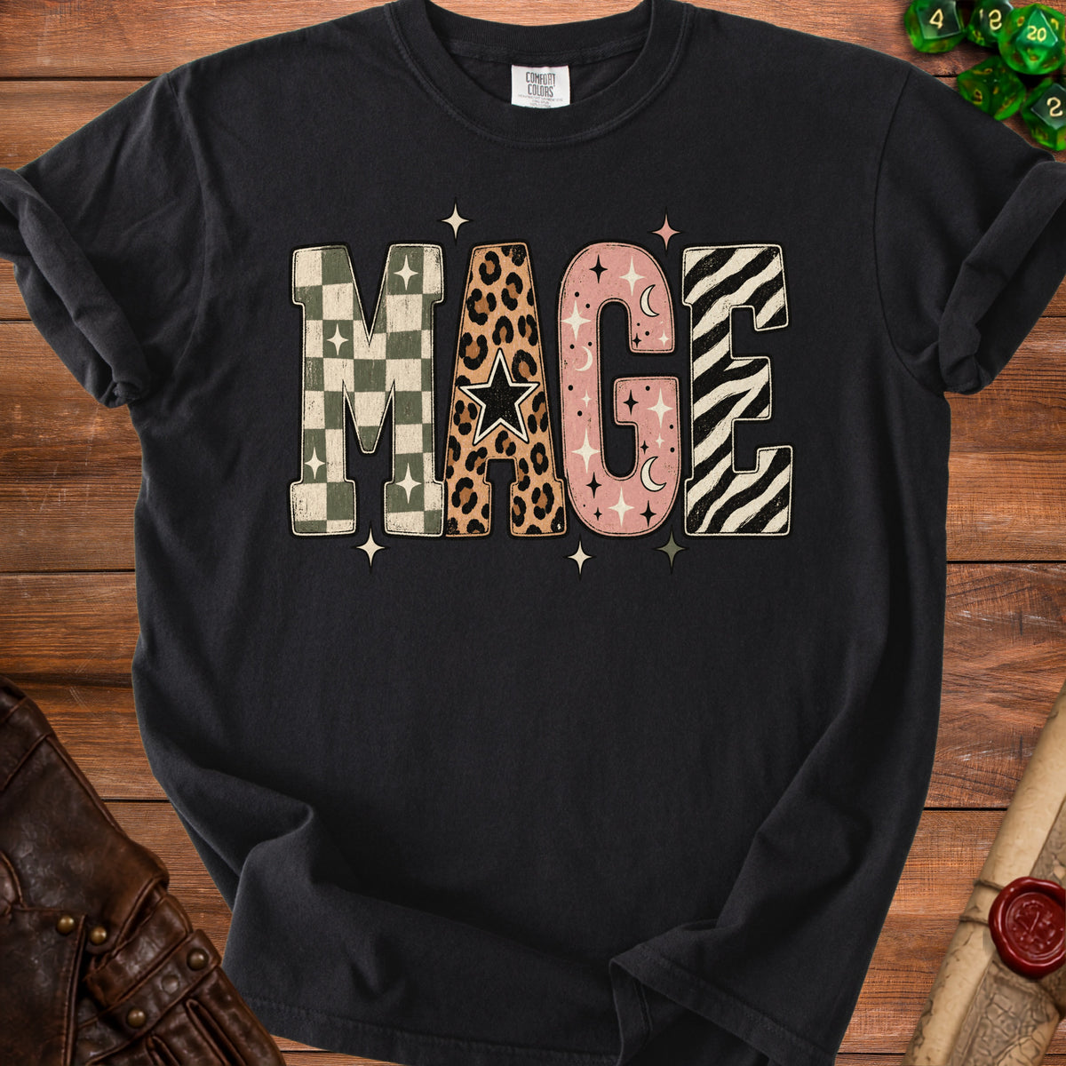 Black t-shirt with "MAGE" graphic in patterned letters and celestial accents.