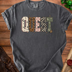 Dark grey t-shirt with the word "QUEST" in patterned block letters.