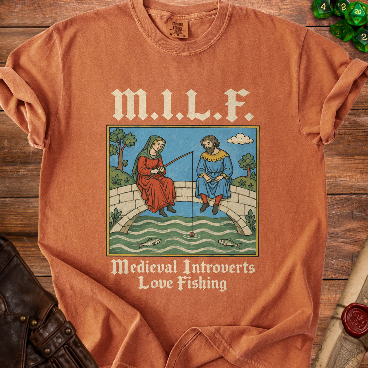 Orange shirt with "M.I.L.F. Medieval Introverts Love Fishing" text and medieval art.