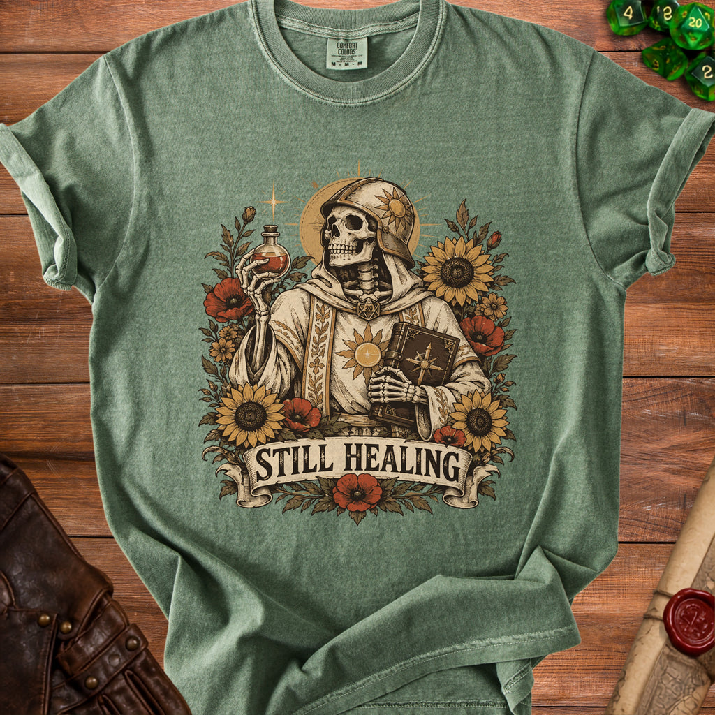 Skeleton in religious attire holding potion and book, with flowers and banner reading "STILL HEALING".