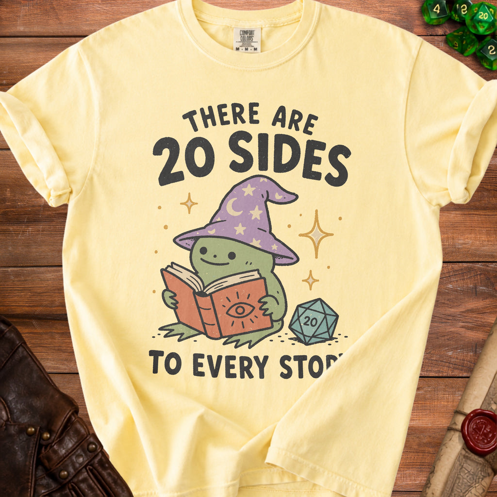 Yellow t-shirt with a graphic of a wizard frog reading a book. Text reads "There are 20 sides to every story."