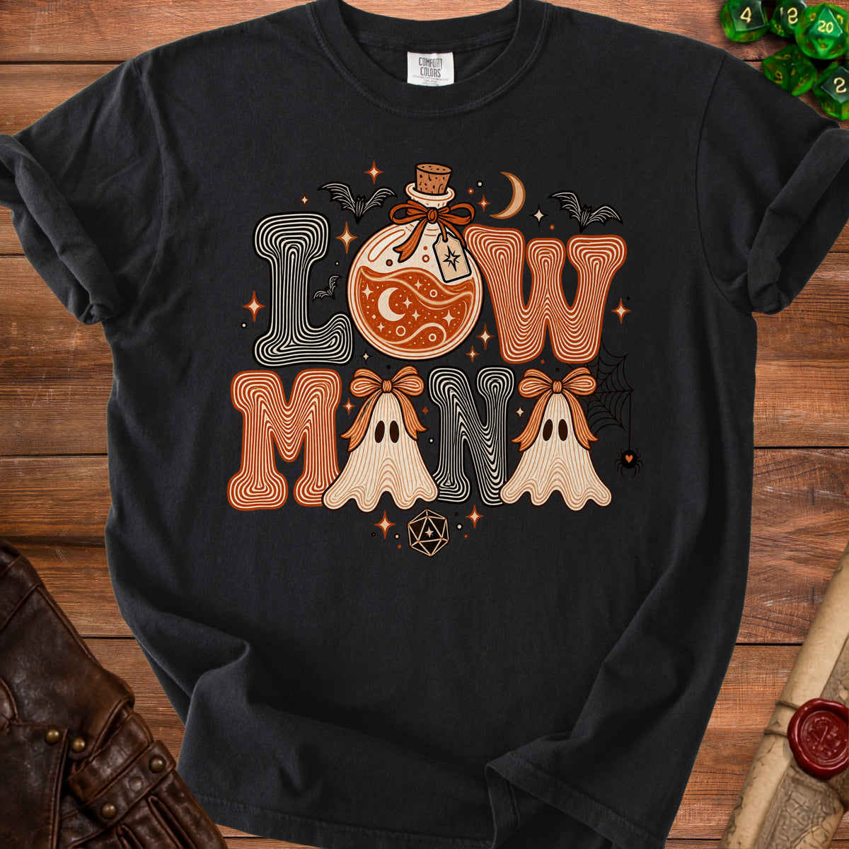 Black t-shirt with "Low Mana" text, potion, ghosts, bats, and dice graphic.