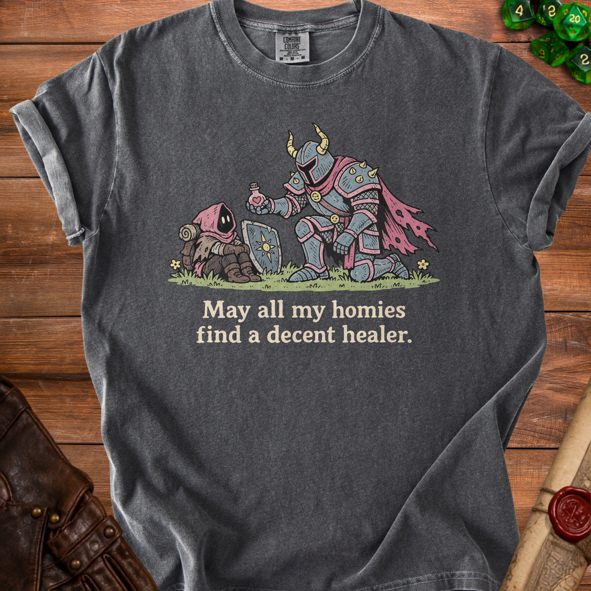 Dark gray t-shirt with a knight offering a potion to a hooded figure, with text.