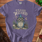 Purple t-shirt graphic with "Trash Wizard" and a raccoon in a trash can.
