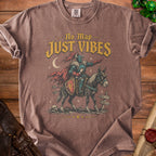 Knight on horseback graphic with text "No Map JUST VIBES" on brown t-shirt.