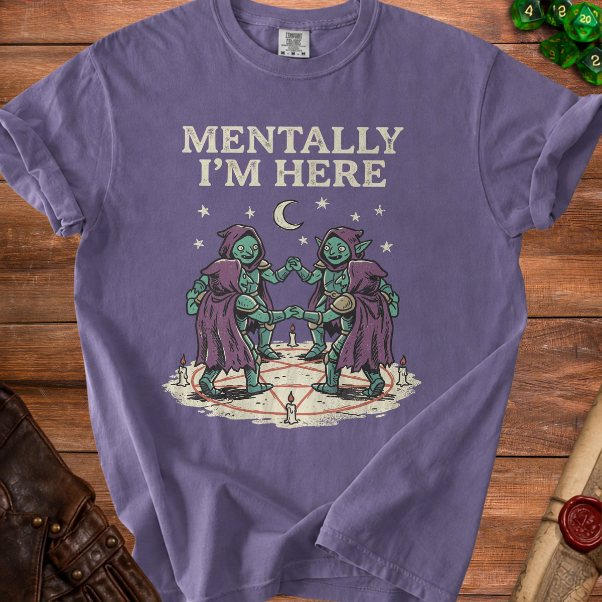 Purple t-shirt with "MENTALLY I'M HERE" text and goblin illustration.