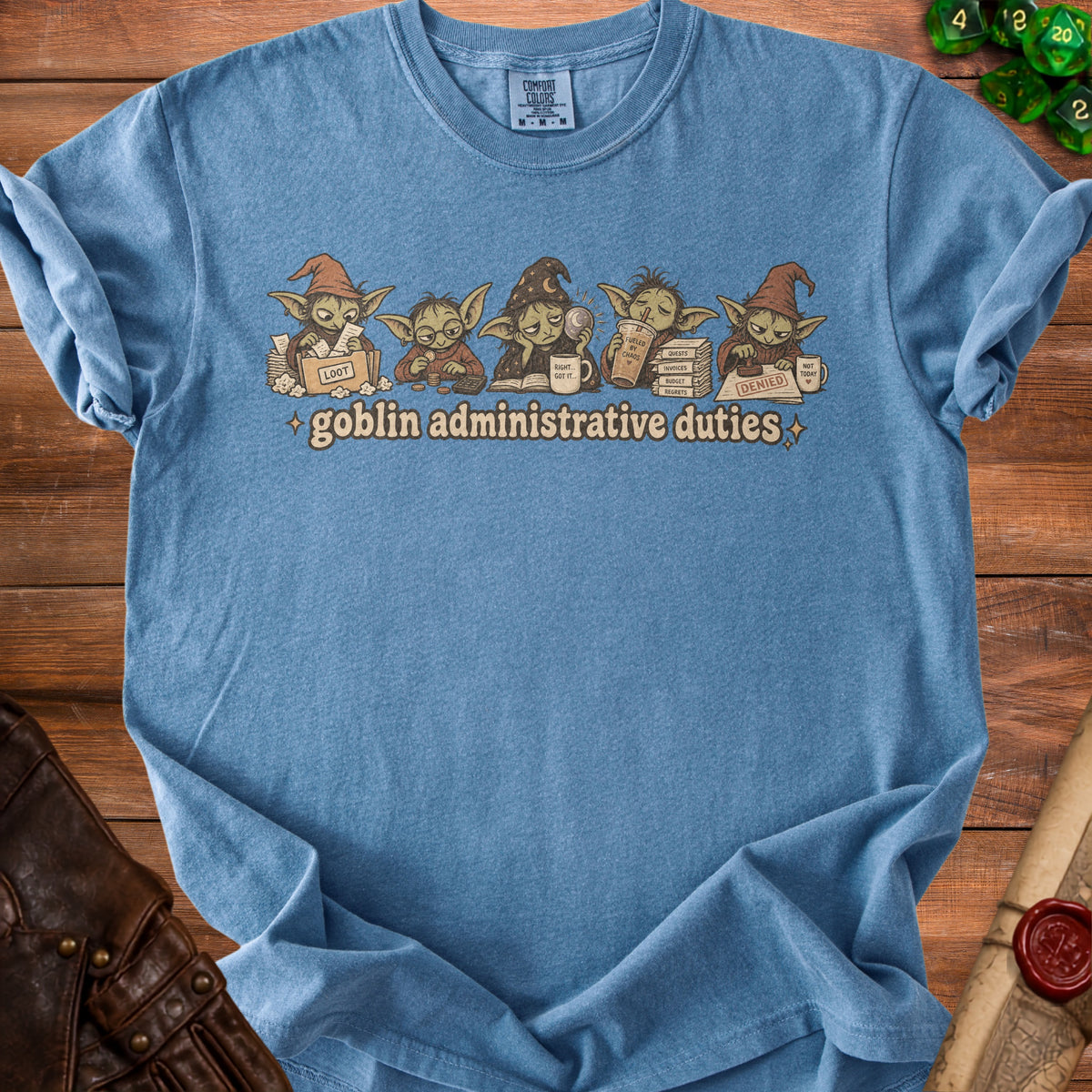 Blue t-shirt with goblins doing administrative duties, "loot," and "denied" stamps.