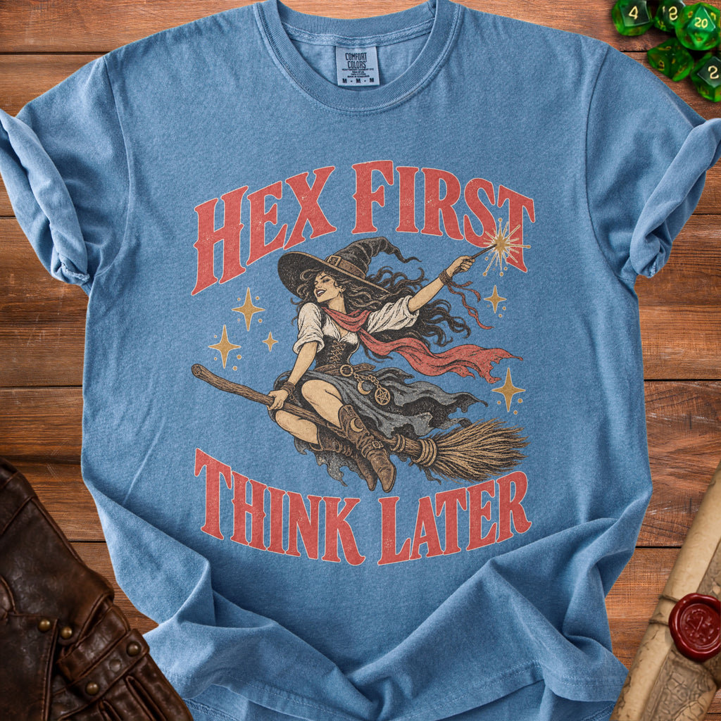 Blue t-shirt with witch graphic and text "Hex First Think Later".