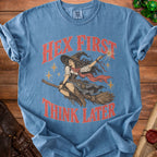 Blue t-shirt with witch graphic and text "Hex First Think Later".
