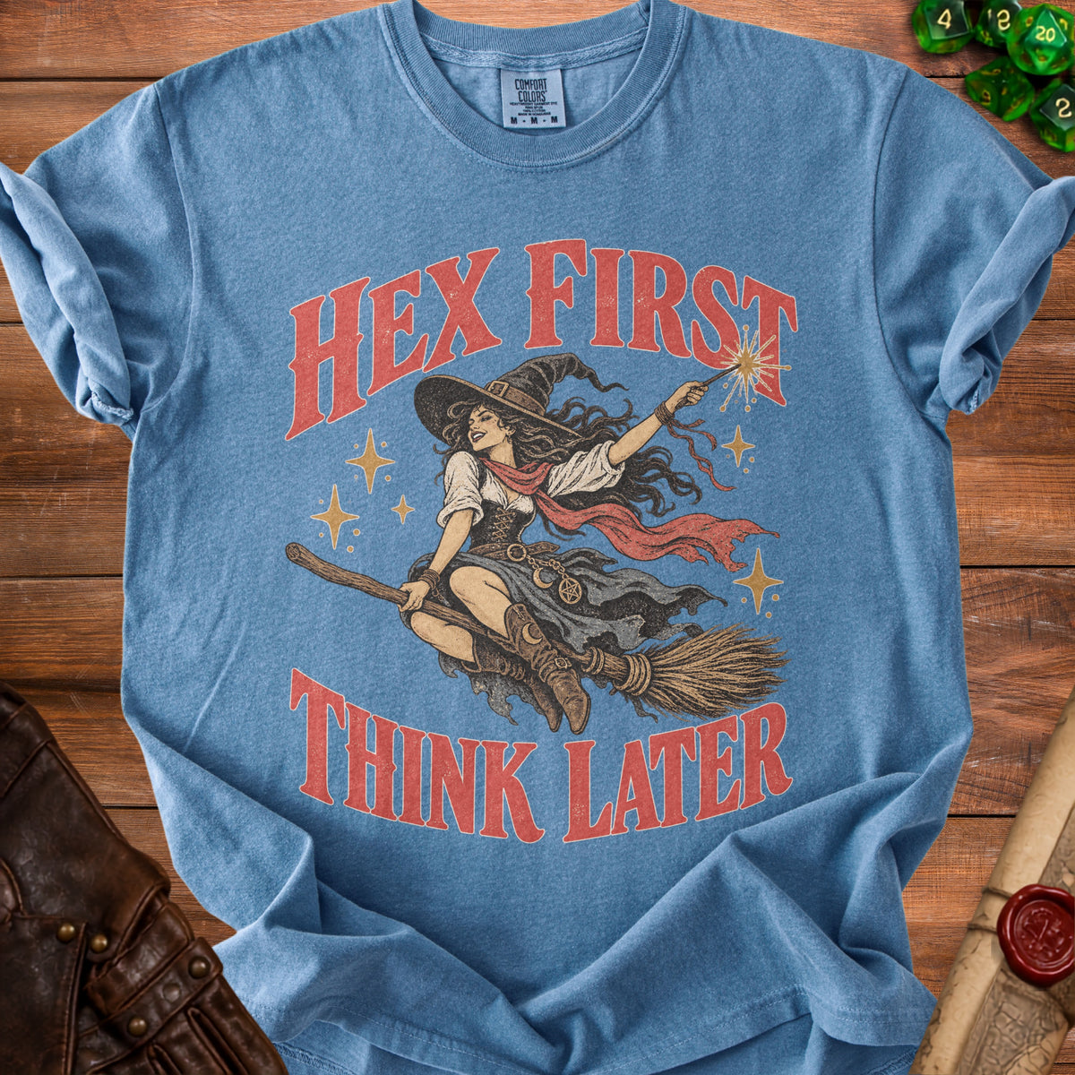 Blue t-shirt with witch graphic and text "Hex First Think Later".