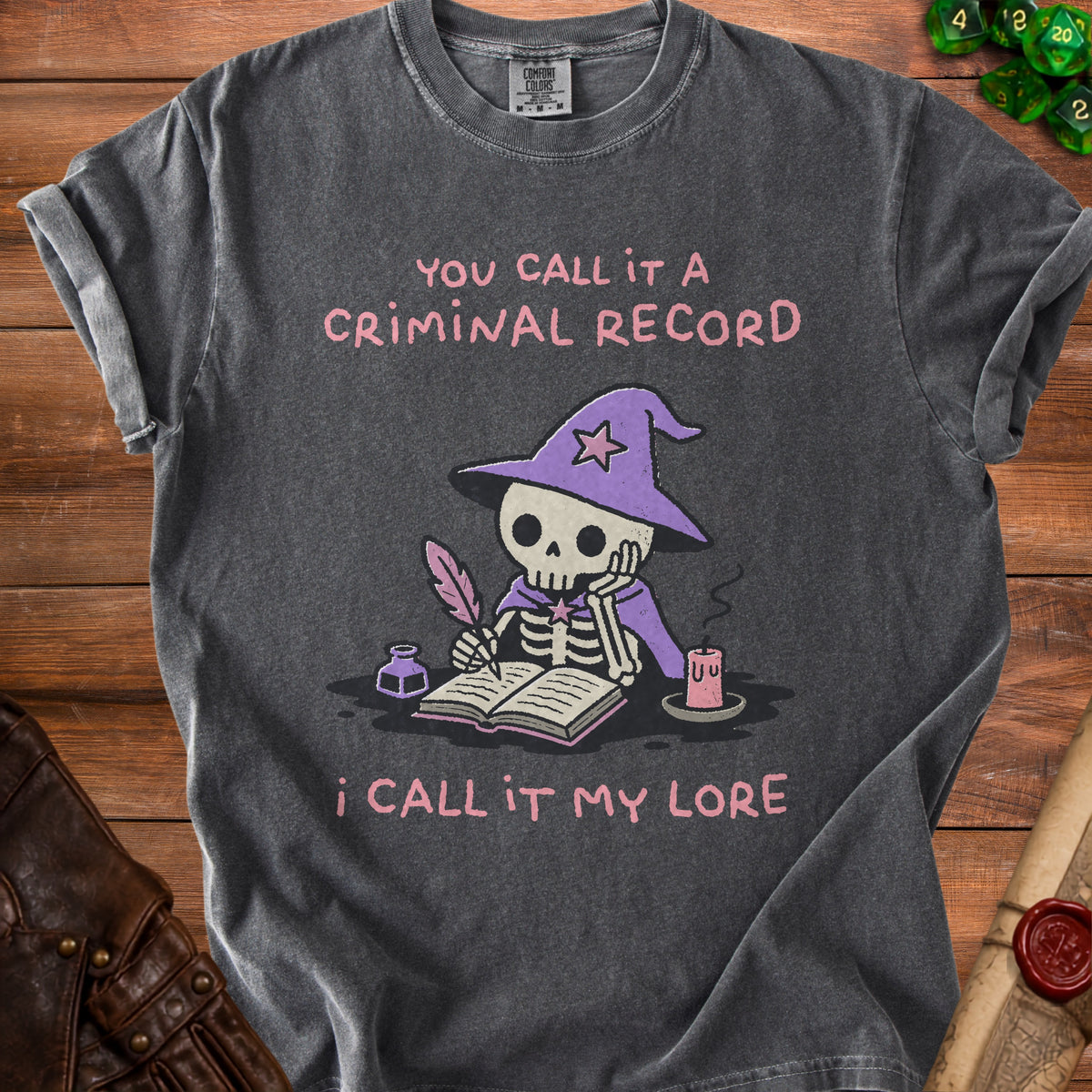 Dark grey t-shirt with skeleton wizard writing "You call it a criminal record, I call it my lore".
