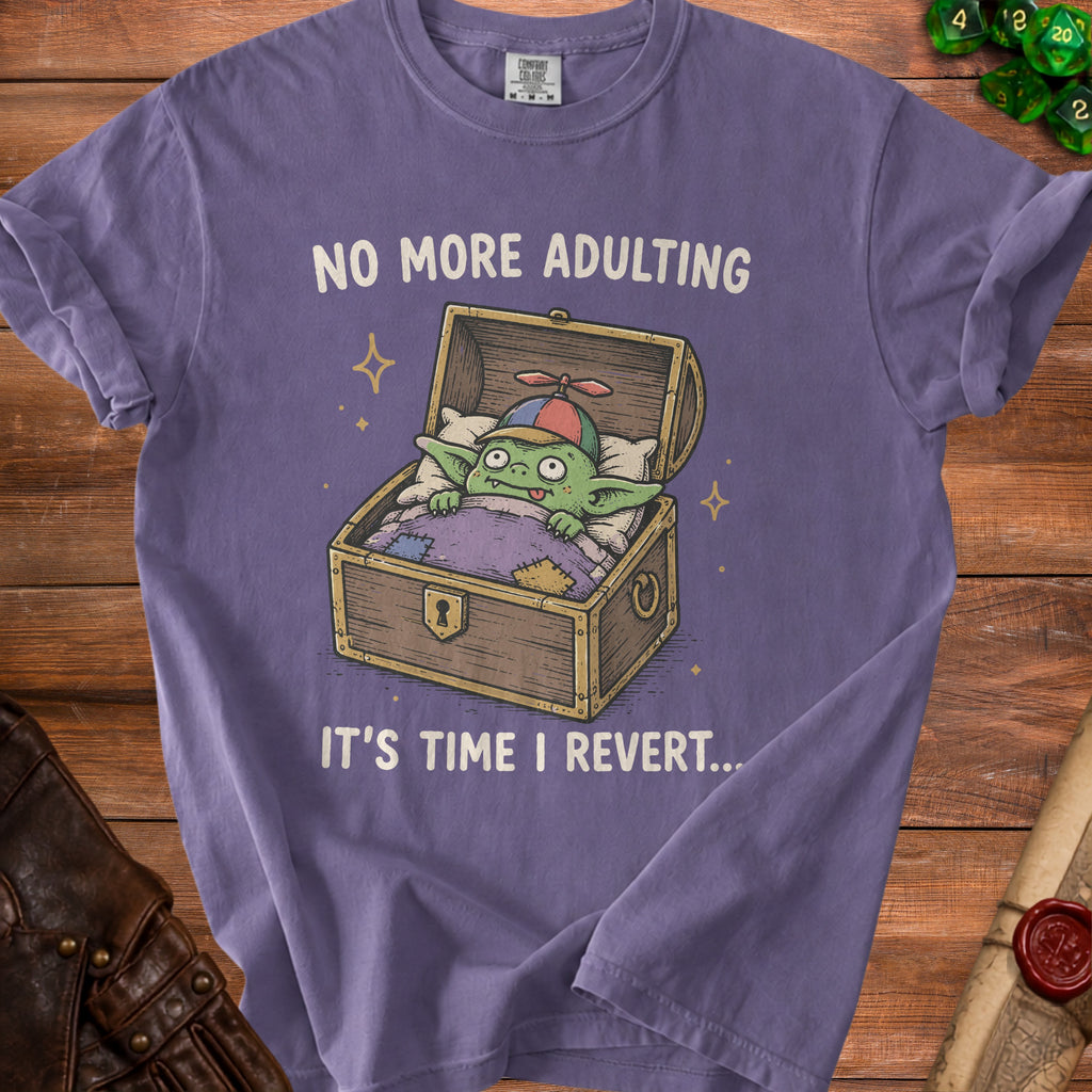 Purple t-shirt with a cartoon goblin in a treasure chest and text "NO MORE ADULTING IT'S TIME I REVERT...".