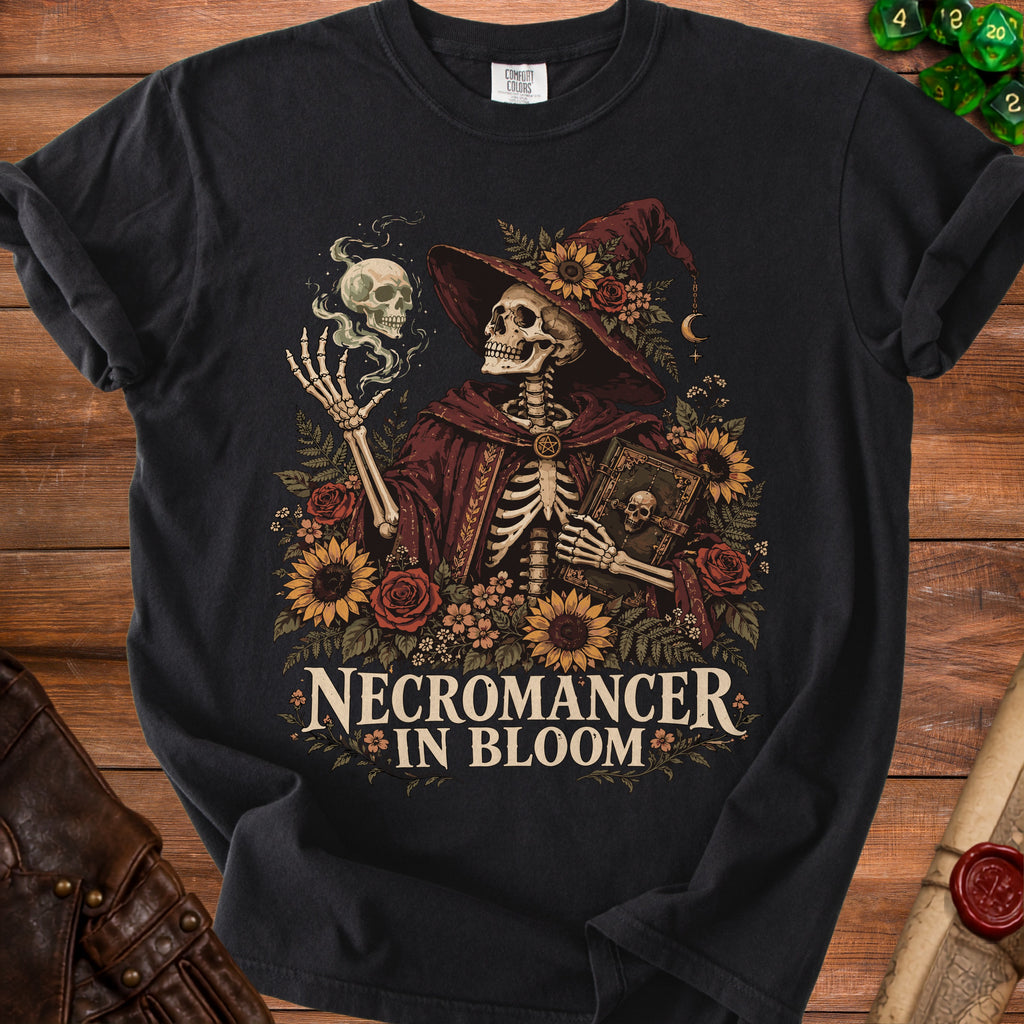 Skeleton necromancer with skull and book surrounded by flowers, text "Necromancer in Bloom".