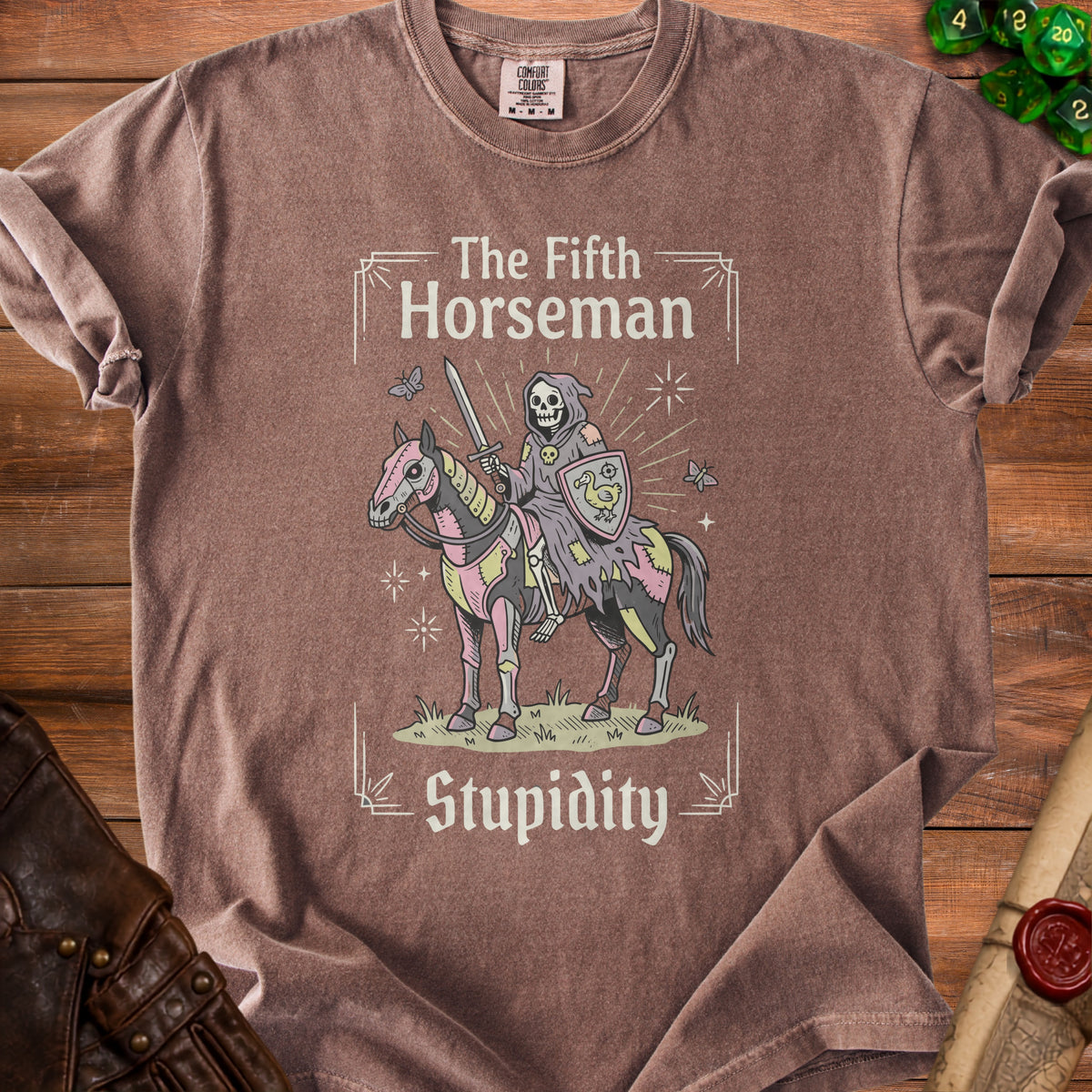 Brown t-shirt with grim reaper on a patchwork horse, text "The Fifth Horseman Stupidity".