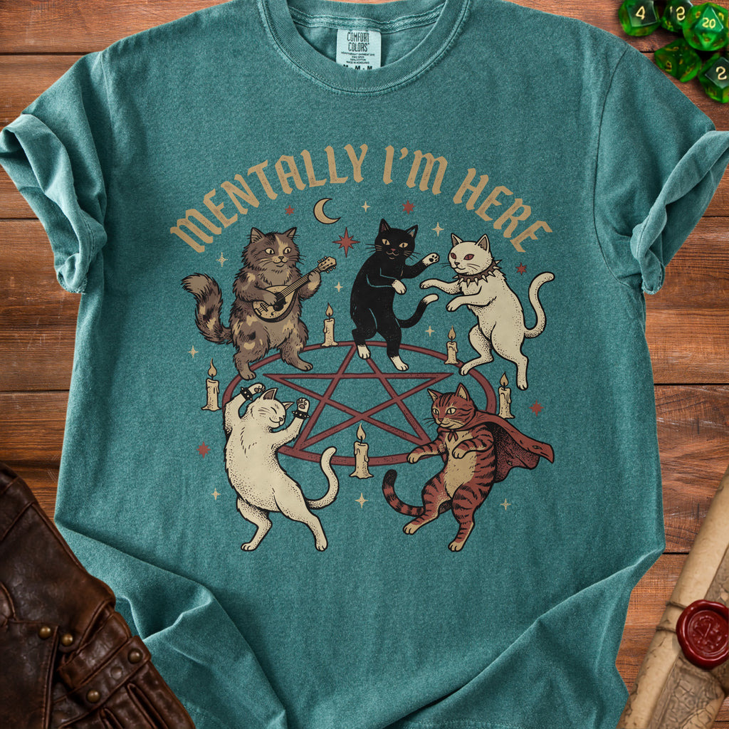 T-shirt with cats dancing around a pentagram and the text "MENTALLY I'M HERE".