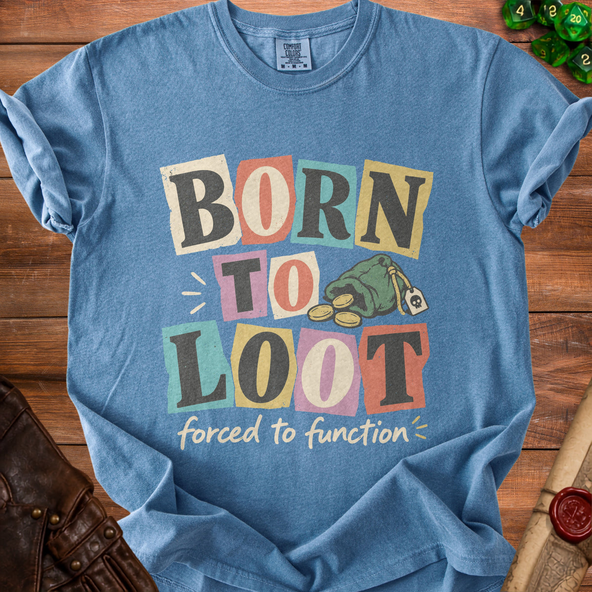 Blue t-shirt with "BORN TO LOOT forced to function" text and a money bag.