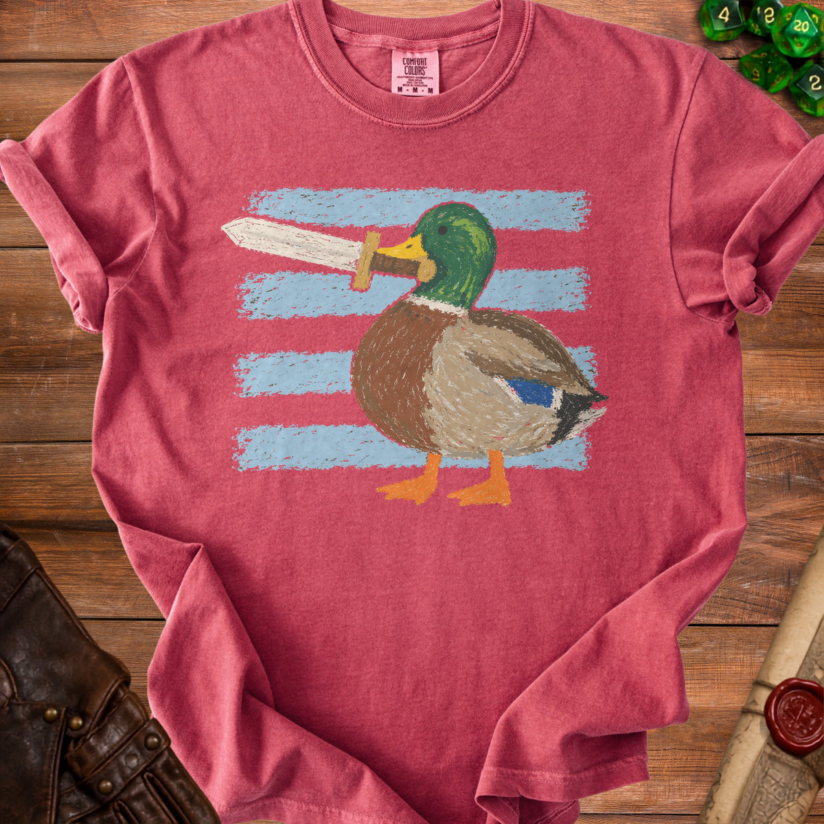 Mallard duck with a sword, in front of blue stripes, on a pink t-shirt.
