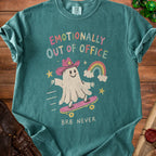 Teal t-shirt with ghost in cowboy hat skateboarding, "Emotionally Out of Office" text.