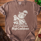 T-shirt with cartoon cat in knight armor holding scroll, text "Low Charisma High Confidence".