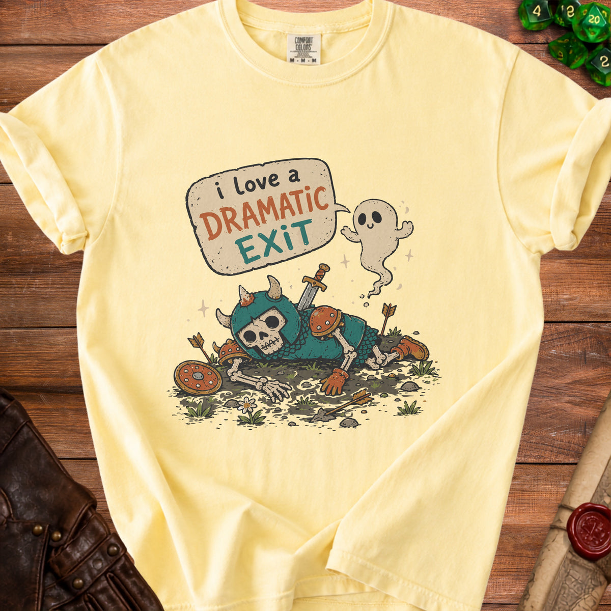Yellow t-shirt graphic of a skeleton warrior with a ghost saying "I love a dramatic exit."