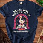 Navy t-shirt with goose on skulls graphic and "Peace was never an option, your goose is cooked."