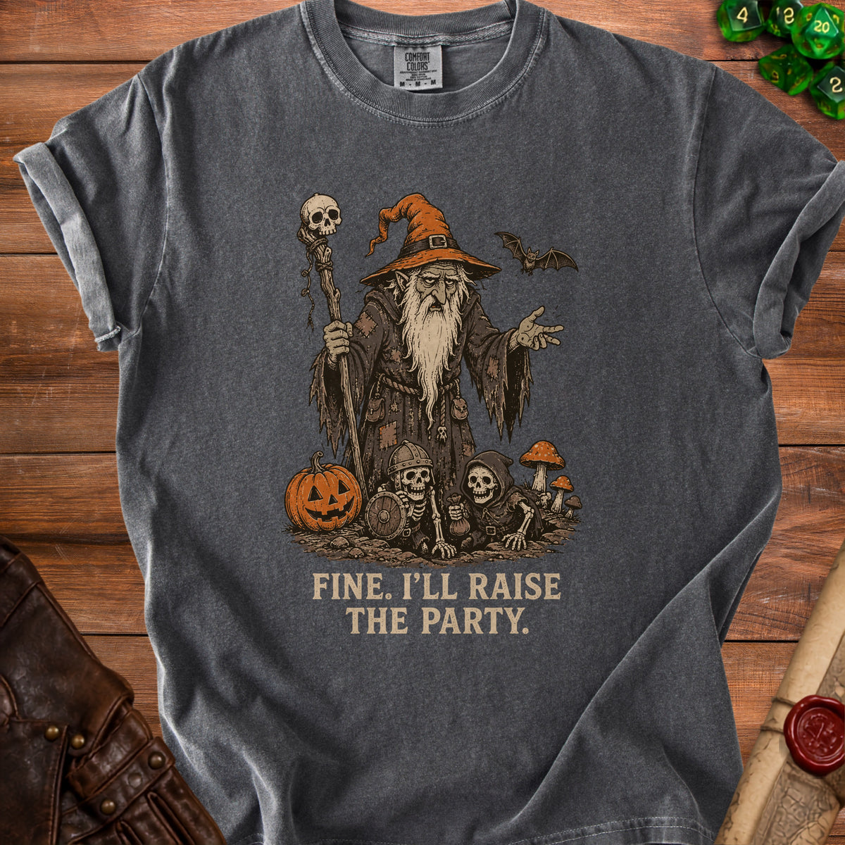 Dark grey t-shirt with wizard, skeletons, pumpkin, and text "FINE. I'LL RAISE THE PARTY."