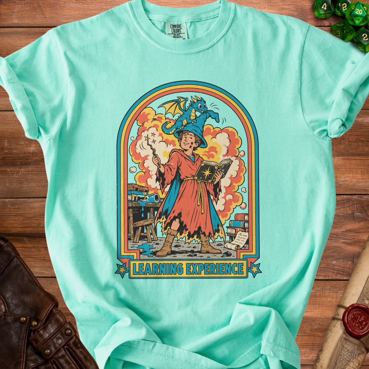 Wizard with a dragon on hat casts a spell from a book, text "LEARNING EXPERIENCE".