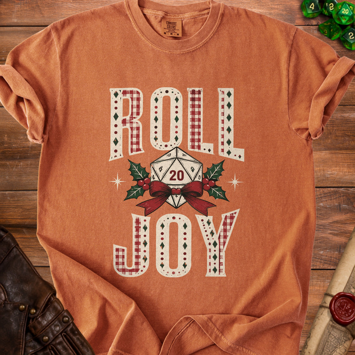 Orange t-shirt with "Roll Joy" text and a D20 die with holly and ribbon.