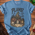 Blue t-shirt with black graphic of cat wizard, map, and text "Plans? I prefer side quests like naps".