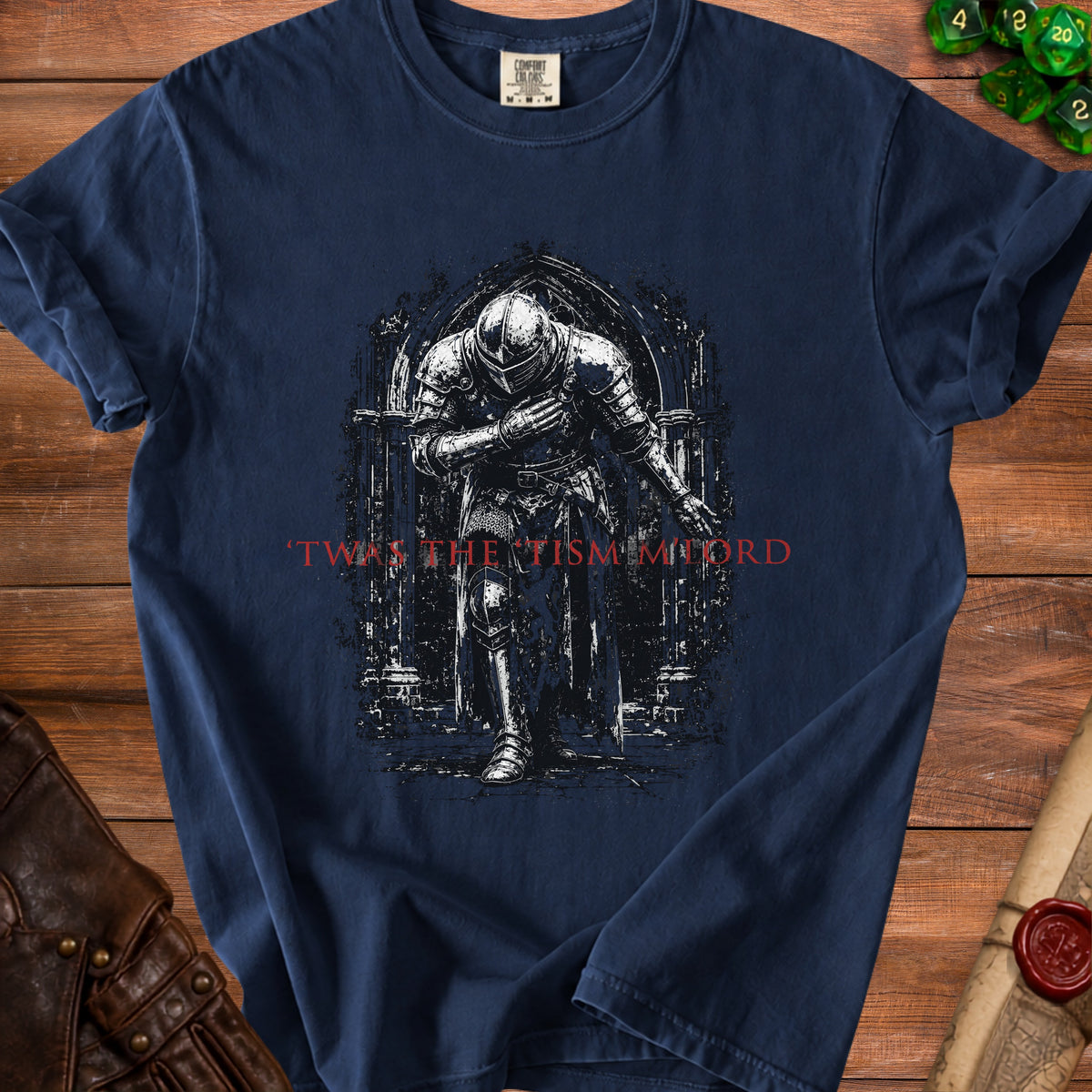 Dark blue t-shirt with knight graphic and red text "Twas the tism. Lord".