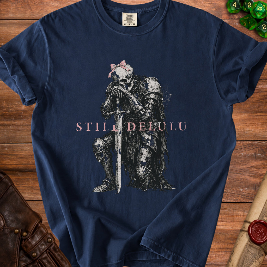 Dark blue t-shirt featuring a skeleton knight in armor with a sword and pink bow.