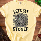 Yellow t-shirt with a graphic of Medusa and text "LET'S GET STONED."