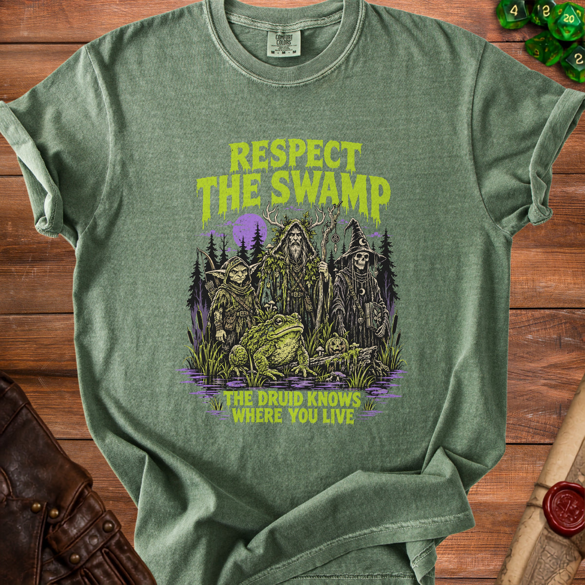Green t-shirt with "Respect the Swamp" and "The Druid Knows Where You Live" text.