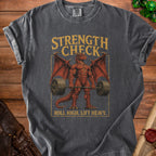 T-shirt with a muscular dragon lifting a barbell and the text "Strength Check Roll High. Lift Heavy."