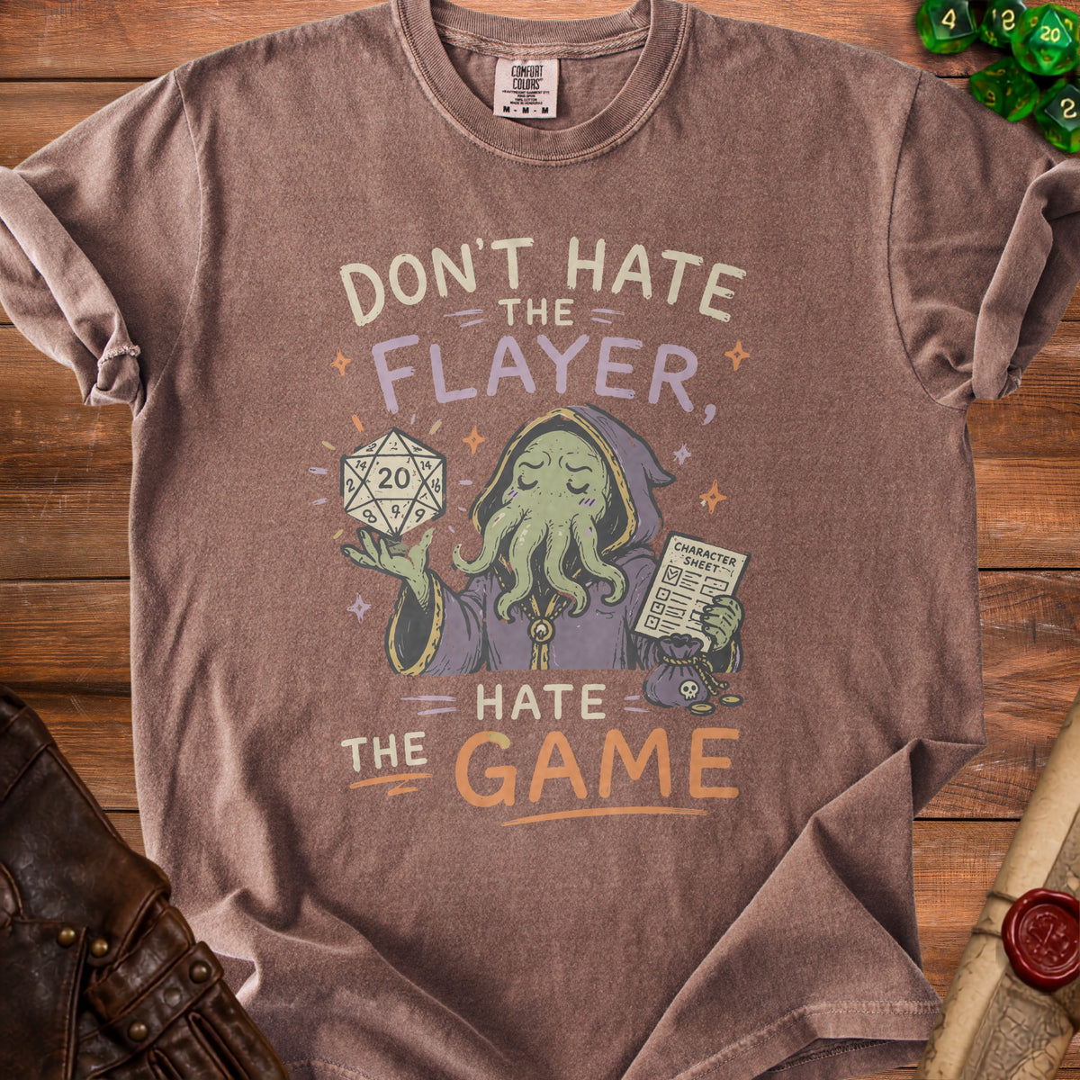 Brown t-shirt with graphic text "Don't Hate the Flayer, Hate the Game".