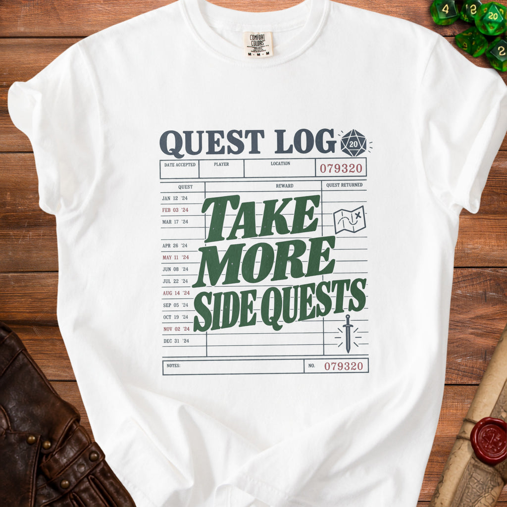 White t-shirt with "Quest Log" design and dice icon.