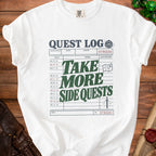 White t-shirt with "Quest Log" design and dice icon.