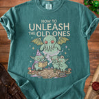 Green t-shirt with illustration of Cthulhu and goblins reading "Old Ones Manual for Dummies."